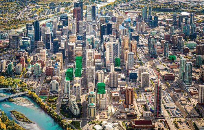 Aerial view of downtown Calgary with green highlights indicating Astra Group's properties